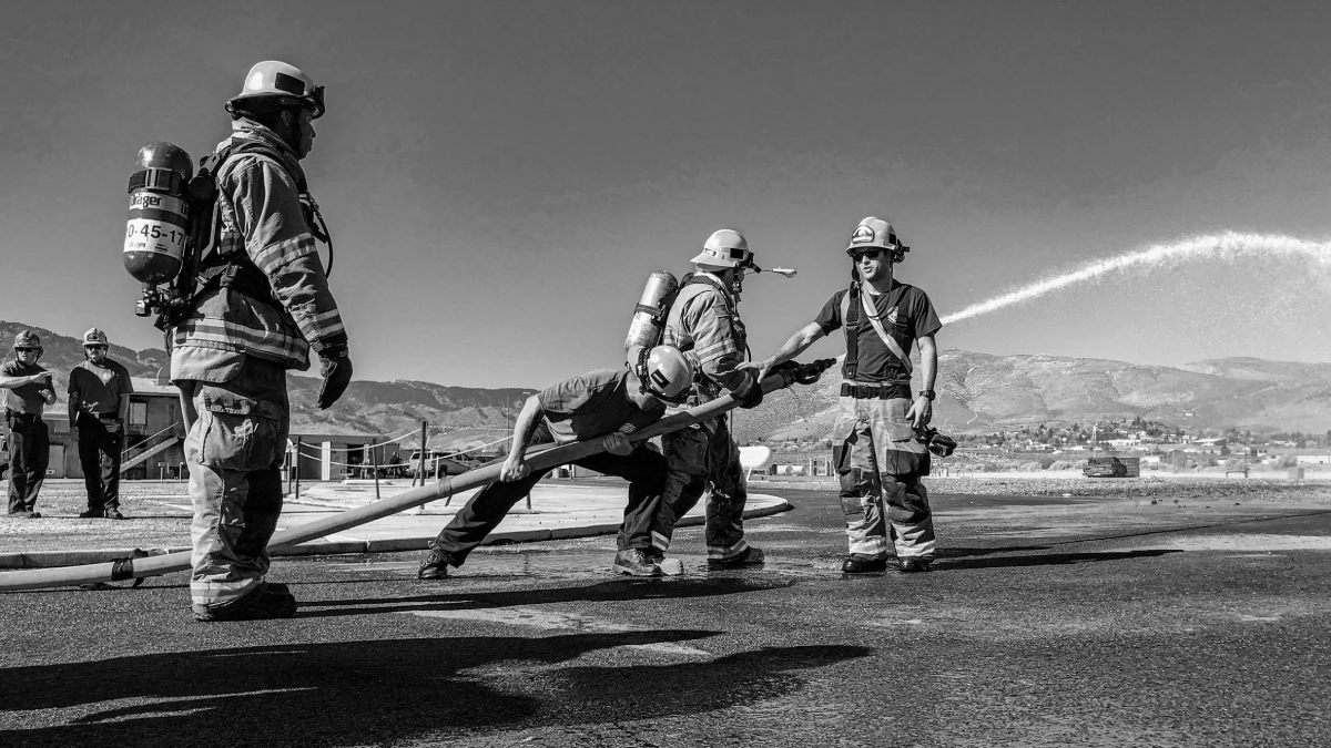 Dudes pulling hose