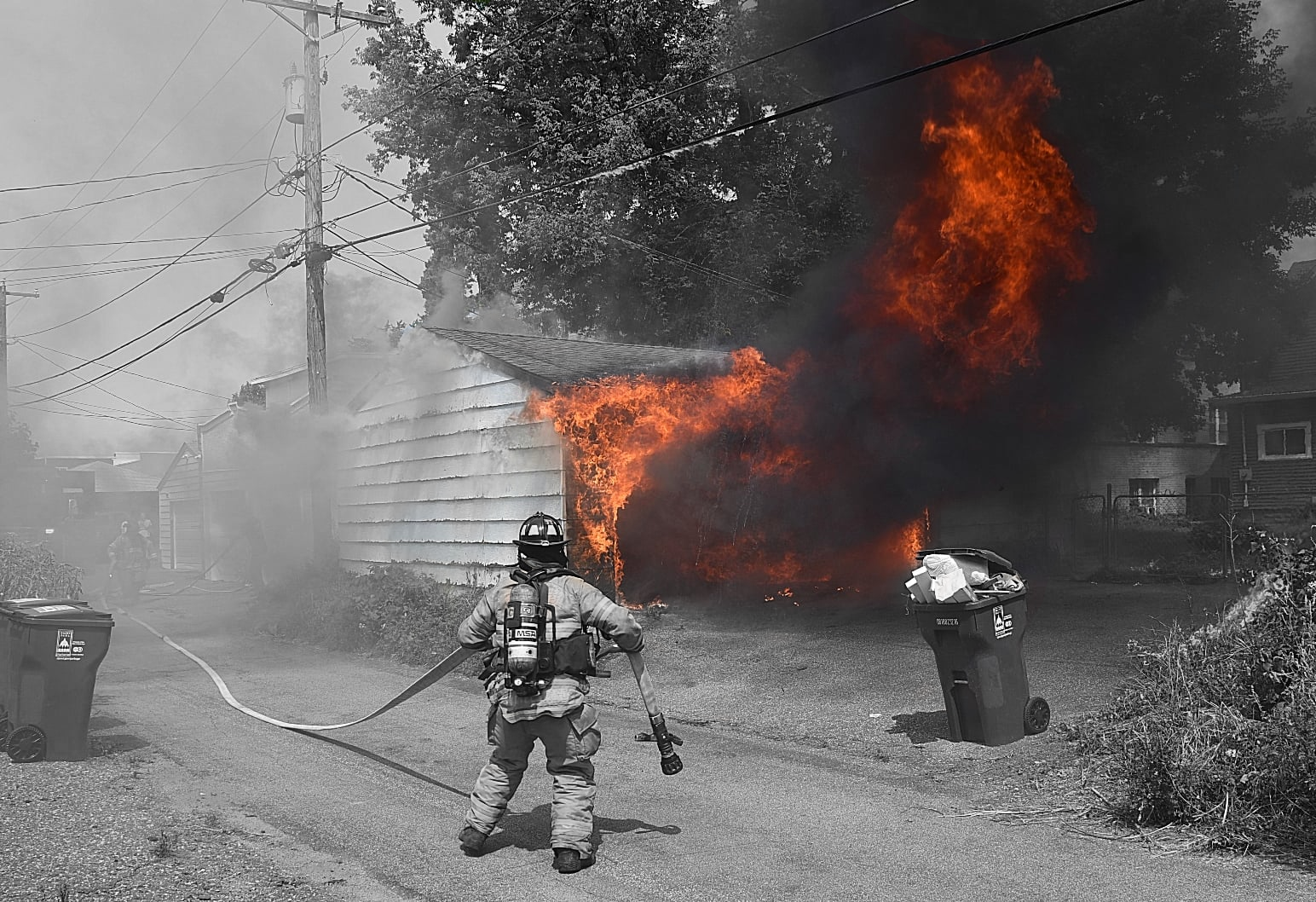 Dudes pulling hose