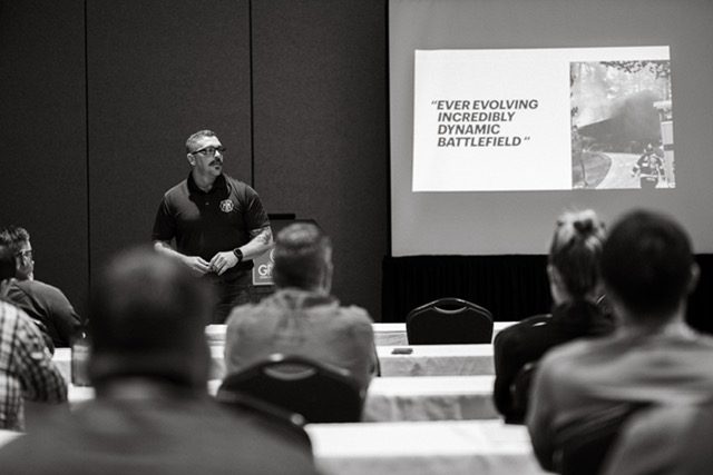 An instructor presenting to a classroom of firefighters